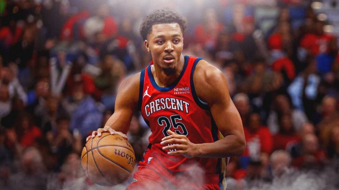 New Orleans Pelicans player Trey Murphy with the Pelicans arena in the background, injury