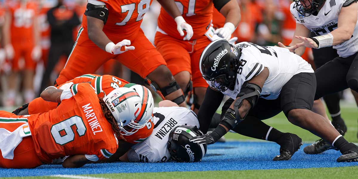 Iowa State Cyclones linebacker Cael Brezina (9) recovers a fumble against the Miami Hurricanes in the first quarter during the Pop Tarts bowl at Camping World Stadium.