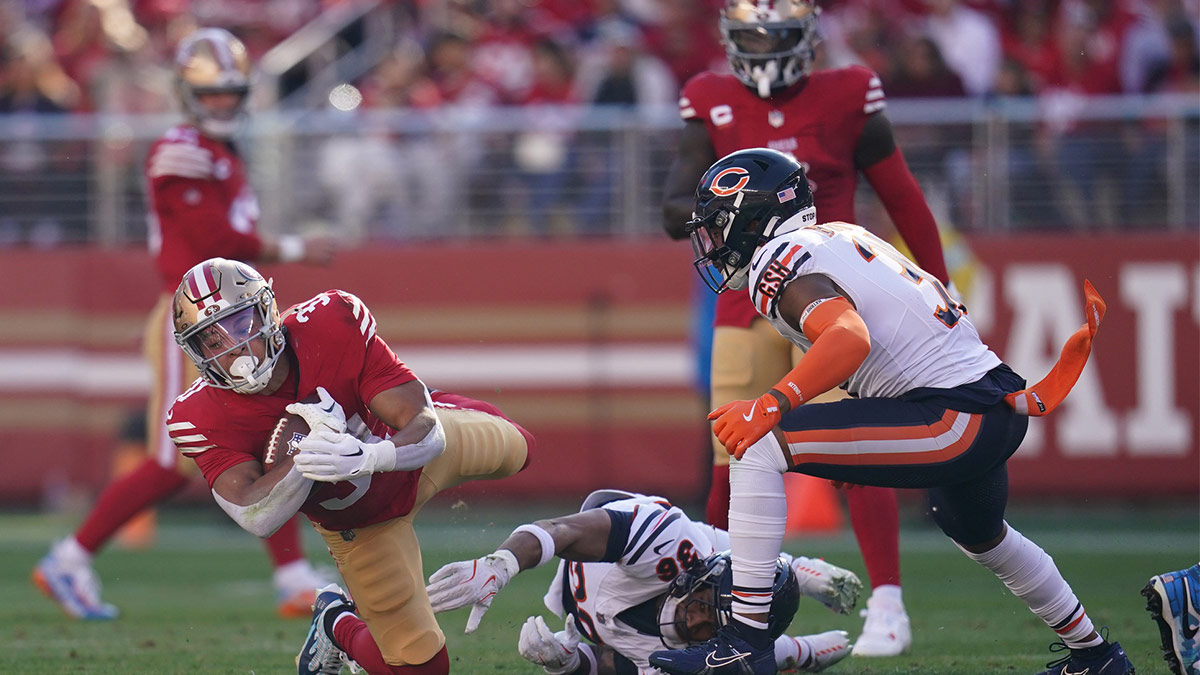 San Francisco 49ers running back Isaac Guerendo (31) dives forward against the Chicago Bears in the first quarter at Levi's Stadium.