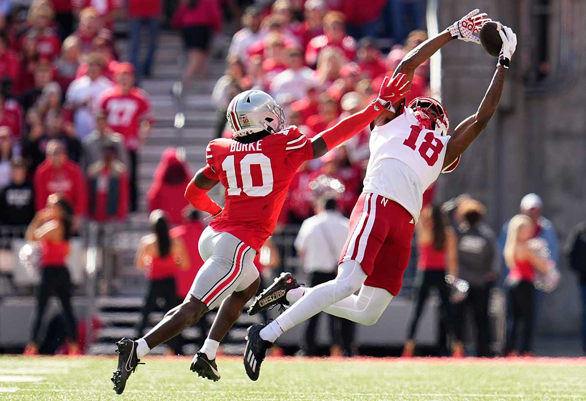 Nebraska Cornhuskers wide receiver Isaiah Neyor (18) attempts a catch behind Ohio State Buckeyes cornerback Denzel Burke (10) during the first half of the NCAA football game at Ohio Stadium in Columbus on Saturday, Oct. 26, 2024