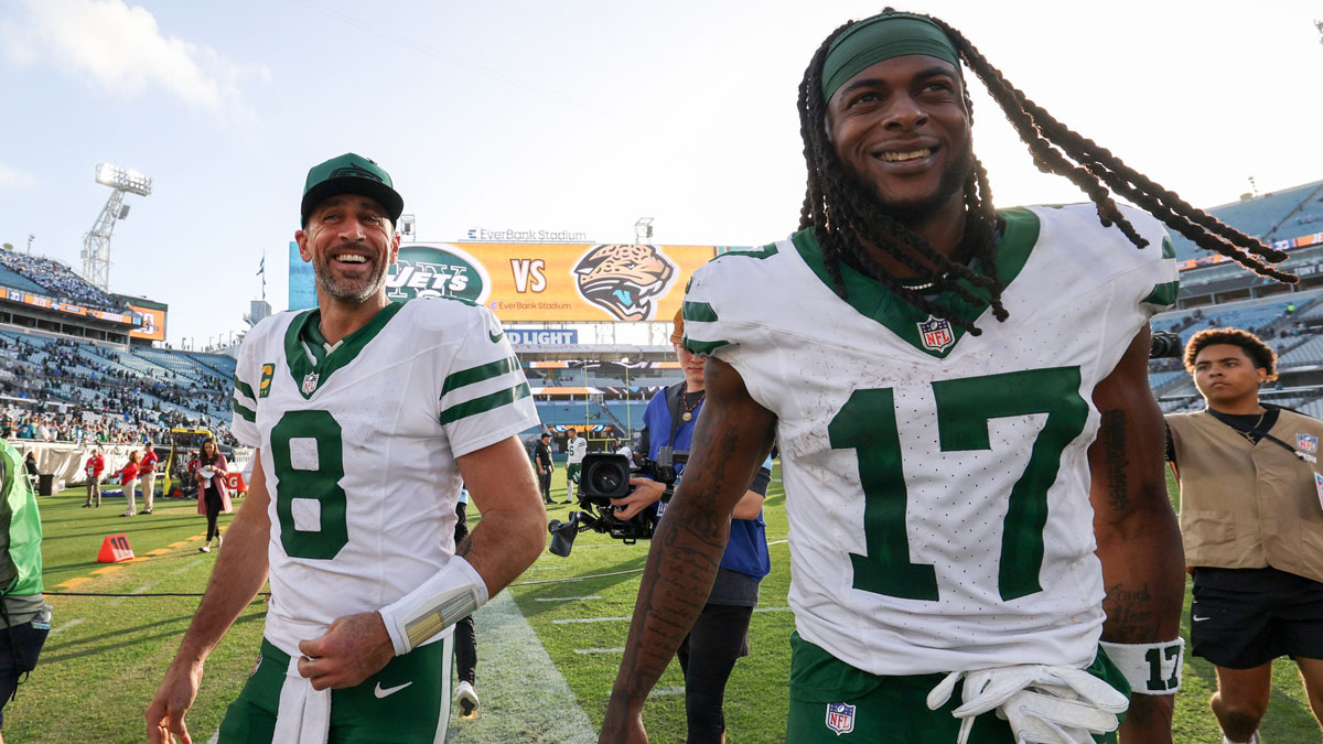 New York Jets quarterback Aaron Rodgers (8) and wide receiver Davante Adams (17) celebrates after beating the Jacksonville Jaguars at EverBank Stadium.