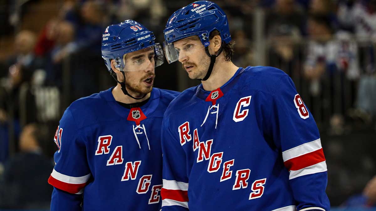 New York Rangers right wing Reilly Smith (91) talks with defenseman Jacob Trouba (8) during a timeout against the St. Louis Blues during the first period at Madison Square Garden.