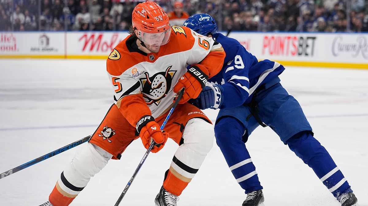 Anaheim Ducks defenseman Jacob Trouba (65) controls the puck against Toronto Maple Leafs forward Pontus Holmberg (29) during the third period at Scotiabank Arena.