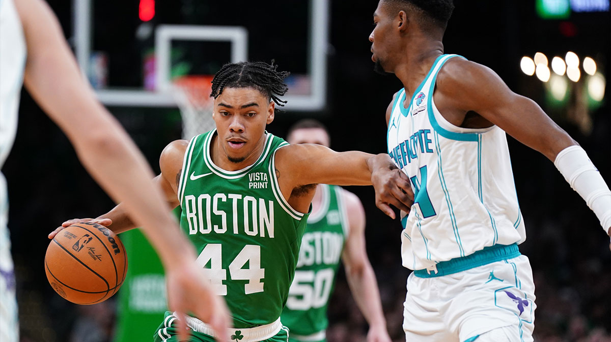 Boston Celtics guard Jaden Springer (44) returns the ball against Charlotte Hornets forward Brandon Miller (24) in the first quarter at TD Garden. 