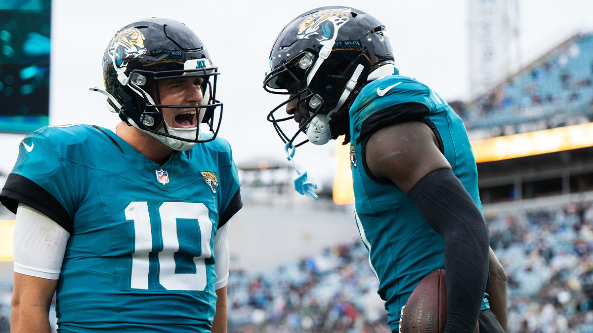 Jacksonville Jaguars wide receiver Brian Thomas Jr (7) and quarterback Mac Jones (10) celebrate a touchdown against the Tennessee Titans in the fourth quarter at EverBank Stadium.