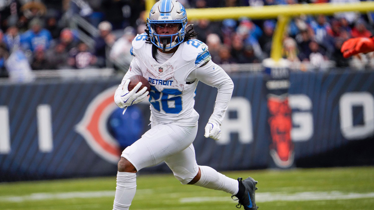 Detroit Lions running back Jahmyr Gibbs (26) runs down the field after receiving the ball at Soldier Field during a game against the Chicago Bears at in Chicago, Ill., on Sunday, Dec. 22, 2024.