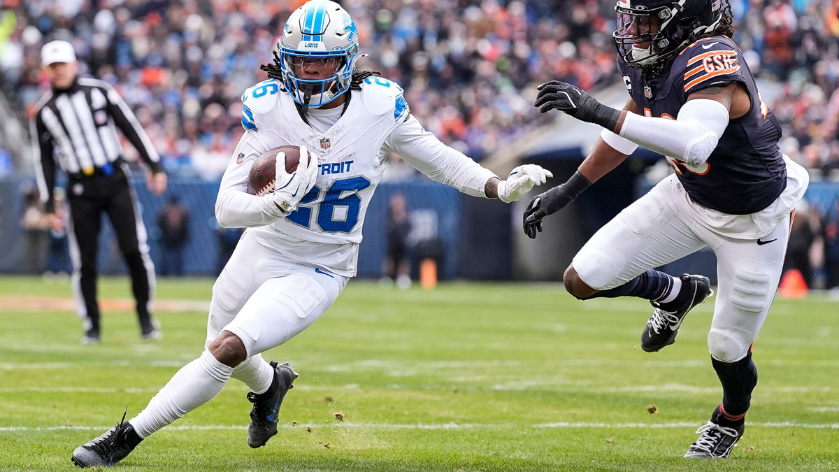 Detroit Lions running back Jahmyr Gibbs (26) runs against Chicago Bears linebacker Tremaine Edmunds (49) during the first half at Soldier Field in Chicago, Ill. on Sunday, Dec. 22, 2024.