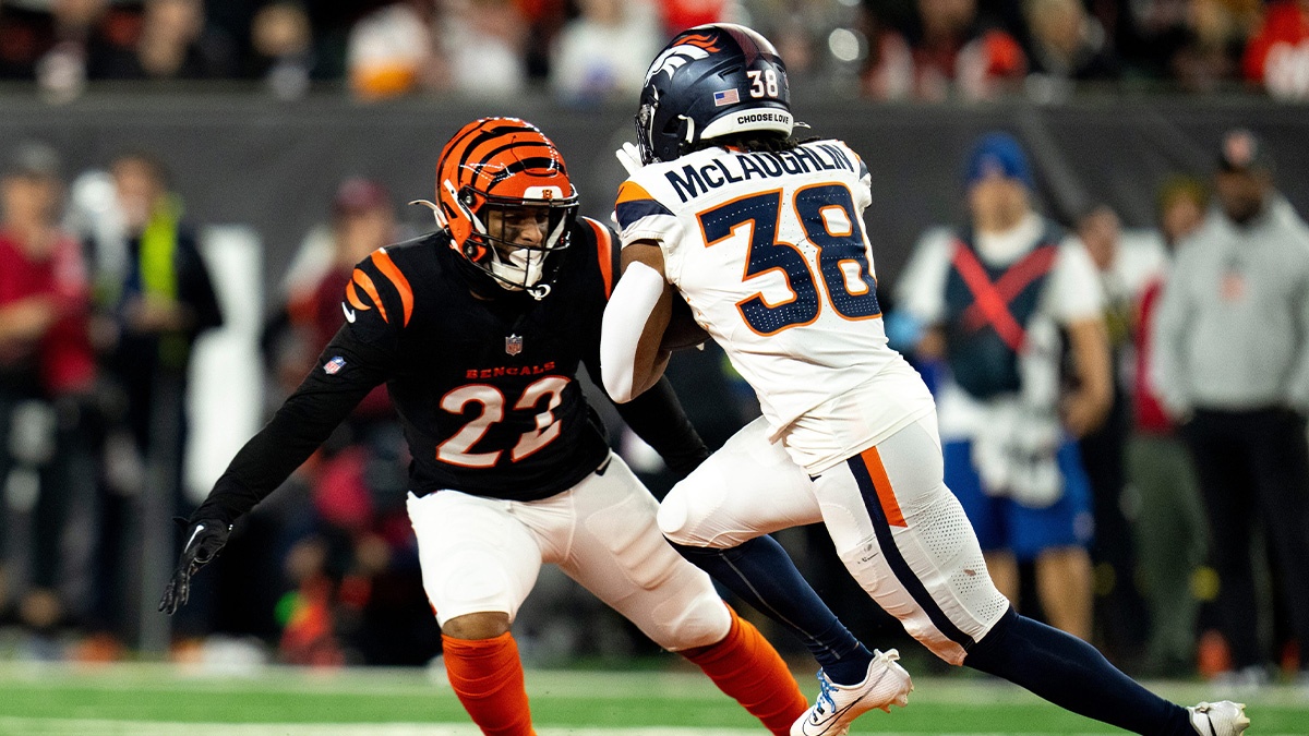 Cincinnati Bengals safety Geno Stone (22) tackles Denver Broncos running back Jaleel McLaughlin (38) in the third quarter of the NFL game at Paycor Stadium in Cincinnati on Saturday, Dec. 28, 2024.