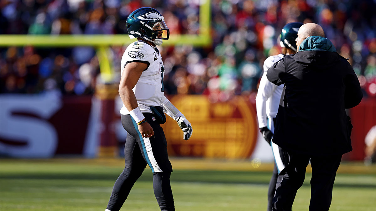 Philadelphia Eagles quarterback Jalen Hurts (1) walks off the field to leave the game during the first quarter against the Washington Commanders at Northwest Stadium.