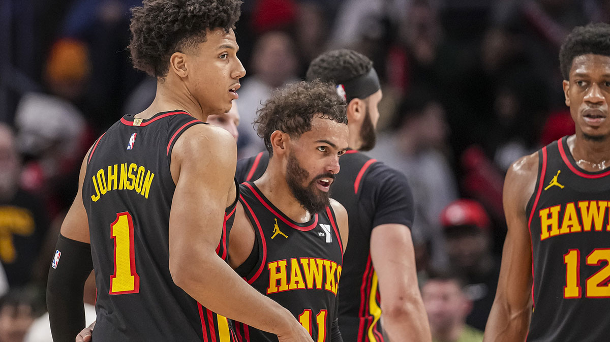 Atlanta Hawks guard Trae Young (11) reacts with forward Jalen Johnson (1) after the Hawks defeated the Miami Heat at State Farm Arena.