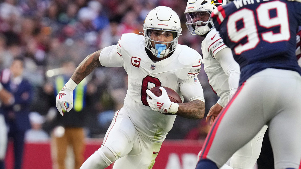 Arizona Cardinals running back James Conner (6) runs with the ball against the New England Patriots at State Farm Stadium on Dec. 15, 2024.