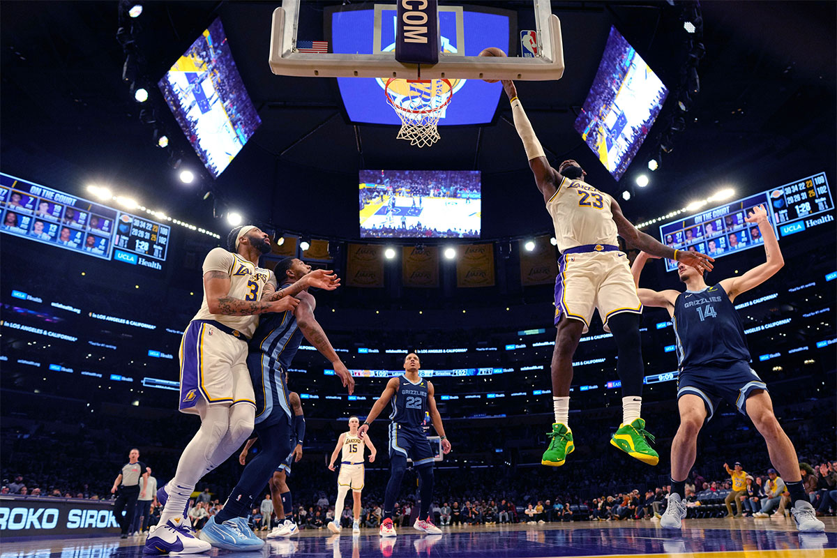 Los Angeles Lakers forward LeBron James (23) shoots the ball against Memphis Grizzlies center Zach Edey (14) in the second half at Crypto.com Arena.