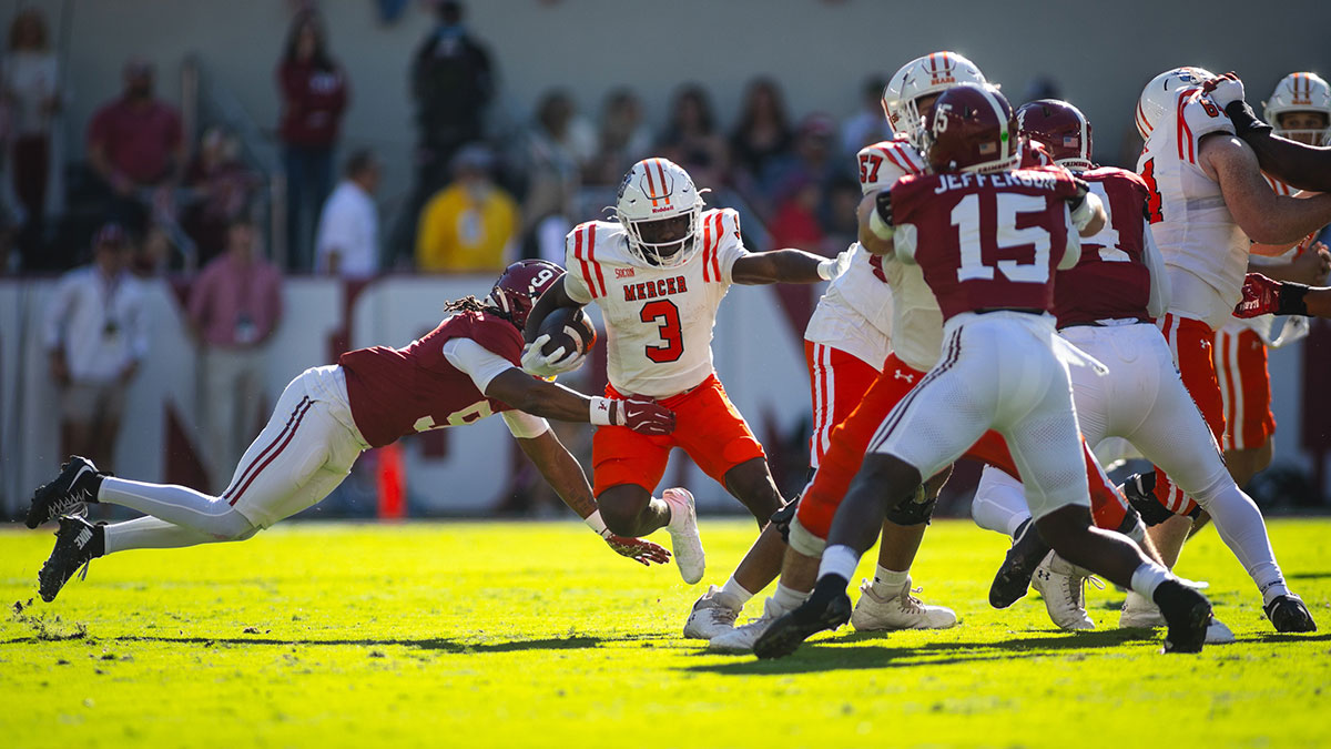 Alabama Crimson Tide defensive back Jaylen Mbakwe (9) dives for Mercer Bears running back Dwayne Mcgee (3) as he carries the ball down the field during the second quarter at Bryant-Denny Stadium.