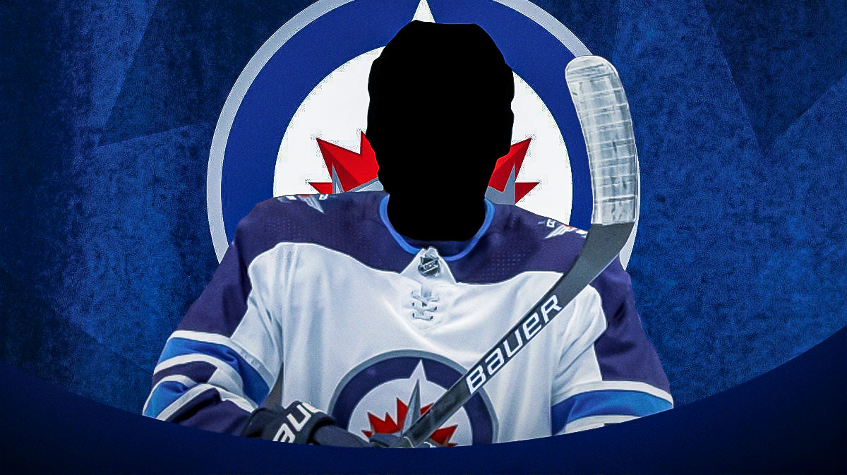 Silhouetted Winnipeg Jets player (no C or A on jersey please), Winnipeg Jets logo, hockey rink in background