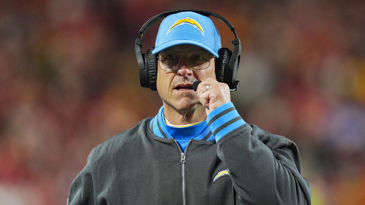 Los Angeles Chargers head coach Jim Harbaugh looks on during the first half against the Kansas City Chiefs at GEHA Field at Arrowhead Stadium.