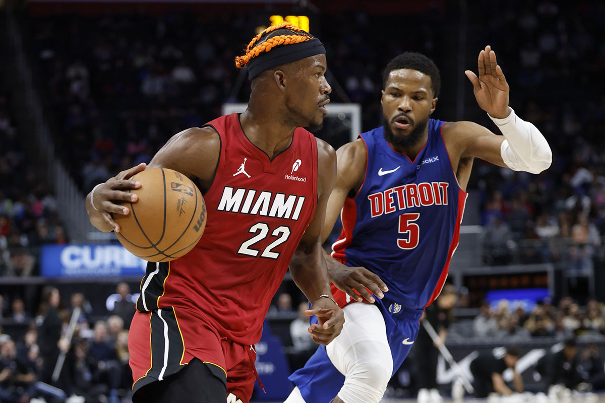 Miami Heat forward Jimmy Butler (22) dribbles as Detroit Pistons guard Malik Beasley (5) defends in the first half at Little Caesars Arena.