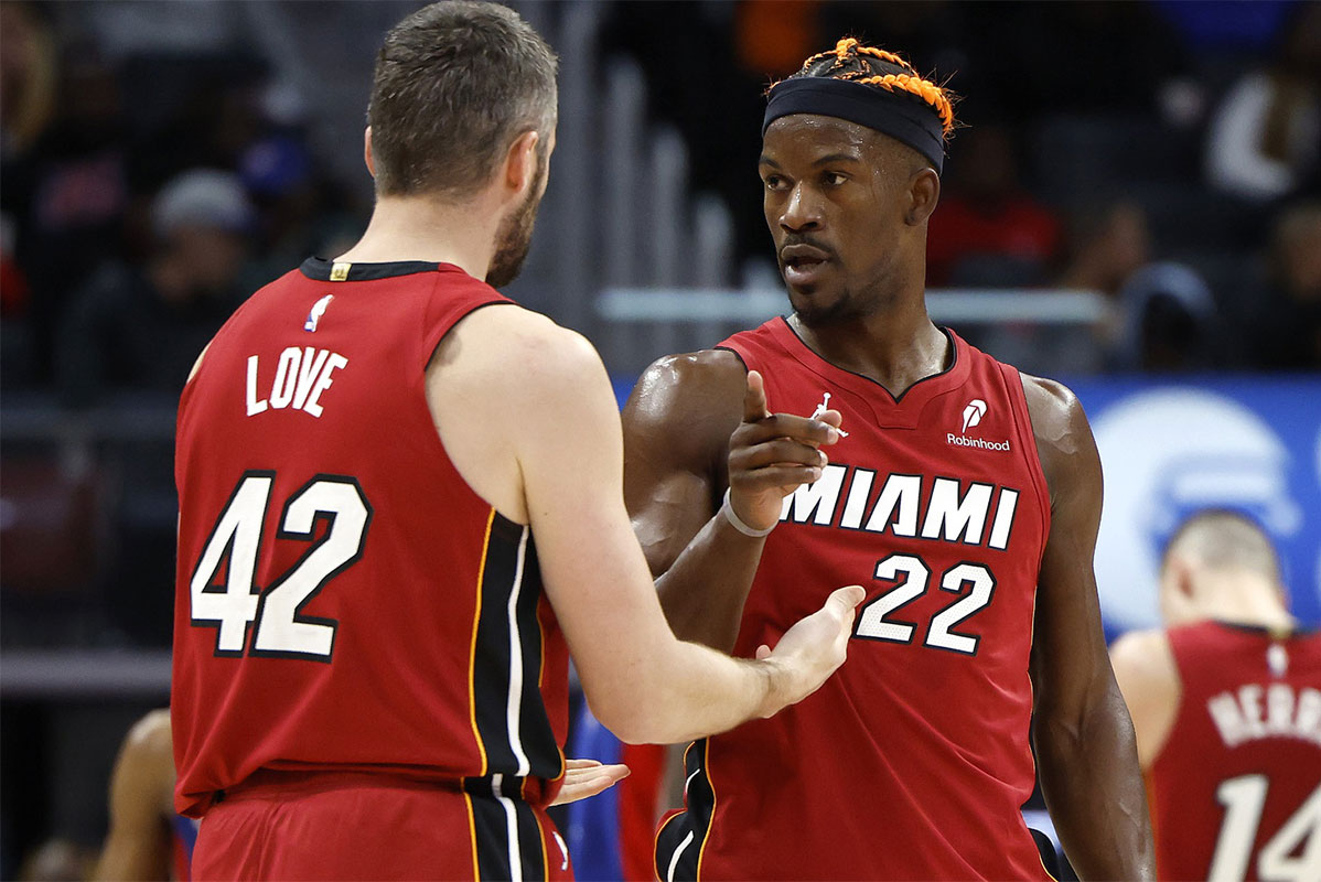 Miami Heat forward Kevin Love (42) talks to forward Jimmy Butler (22) in the second half against the Detroit Pistons at Little Caesars Arena.