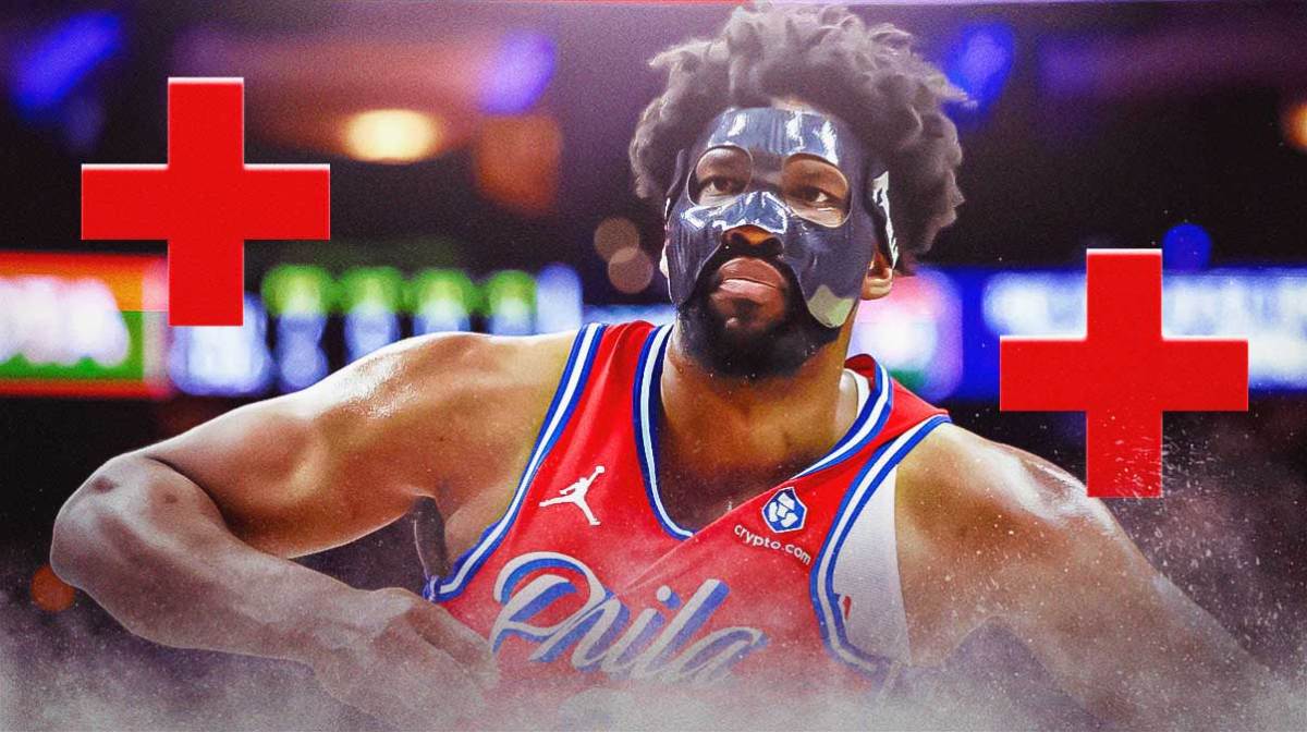 Philadelphia 76ers star Joel Embiid with injury signs around him in front of the Wells Fargo Center.