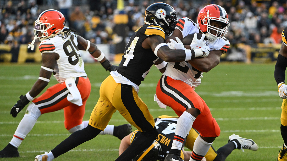 Pittsburgh Steelers cornerback Joey Porter Jr. (24) tackles Cleveland Browns running back Nick Chubb (24) during the third quarter at Acrisure Stadium. Mandatory Credit: Barry Reeger-Imagn Images