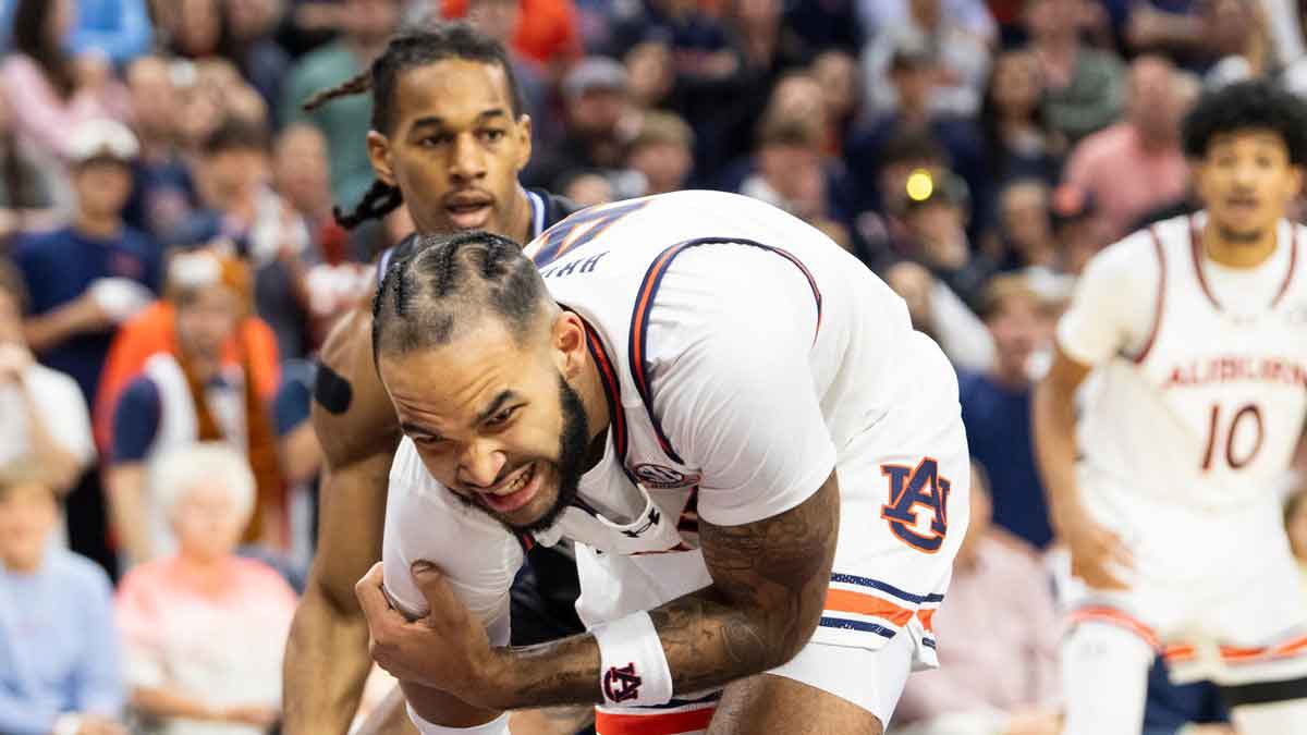 Auburn Tigers forward Johni Broome (4) grabs at his shoulder after an apparent injury as Auburn Tigers take on Georgia State Panthers at Neville Arena in Auburn, Ala., on Tuesday, Dec. 17, 2024.