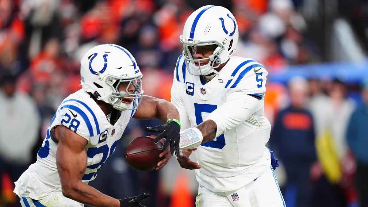 Indianapolis Colts quarterback Anthony Richardson (5) hands off to running back Jonathan Taylor (28) in the second half against the Denver Broncos at Empower Field at Mile High.