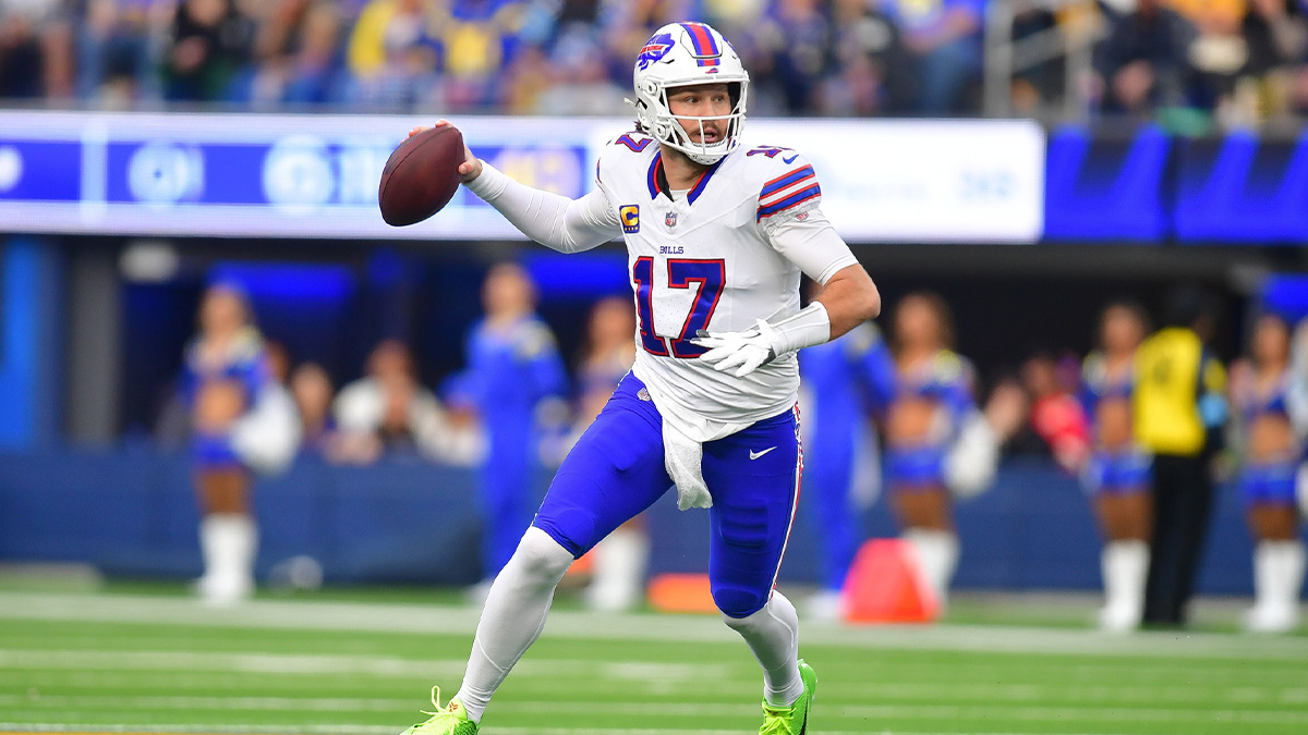 Buffalo Bills quarterback Josh Allen (17) moves out to pass against the Los Angeles Rams during the first half at SoFi Stadium.