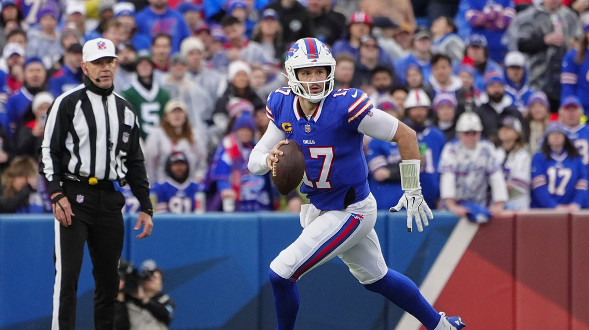 Buffalo Bills quarterback Josh Allen (17) rolls out looking to throw the ball against the New York Jets during the first half at Highmark Stadium.