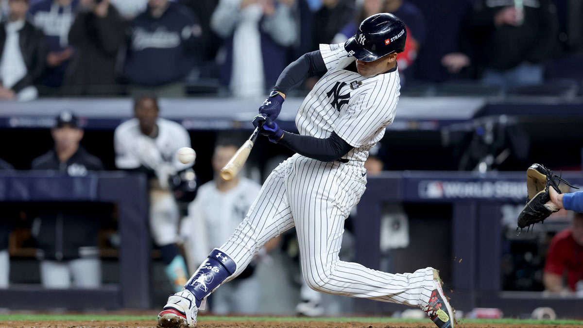 New York Yankees outfielder Juan Soto (22) doubles during the eighth inning against the Los Angeles Dodgers in game four of the 2024 MLB World Series at Yankee Stadium.