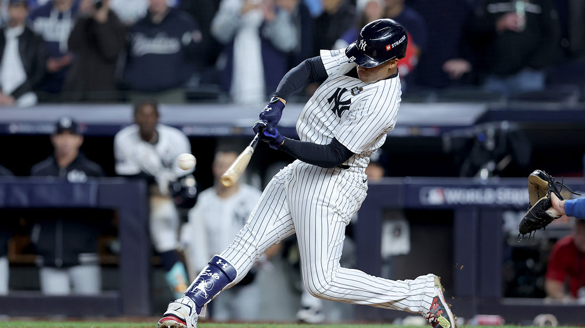 New York Yankees outfielder Juan Soto (22) doubles during the eighth inning against the Los Angeles Dodgers in game four of the 2024 MLB World Series at Yankee Stadium.