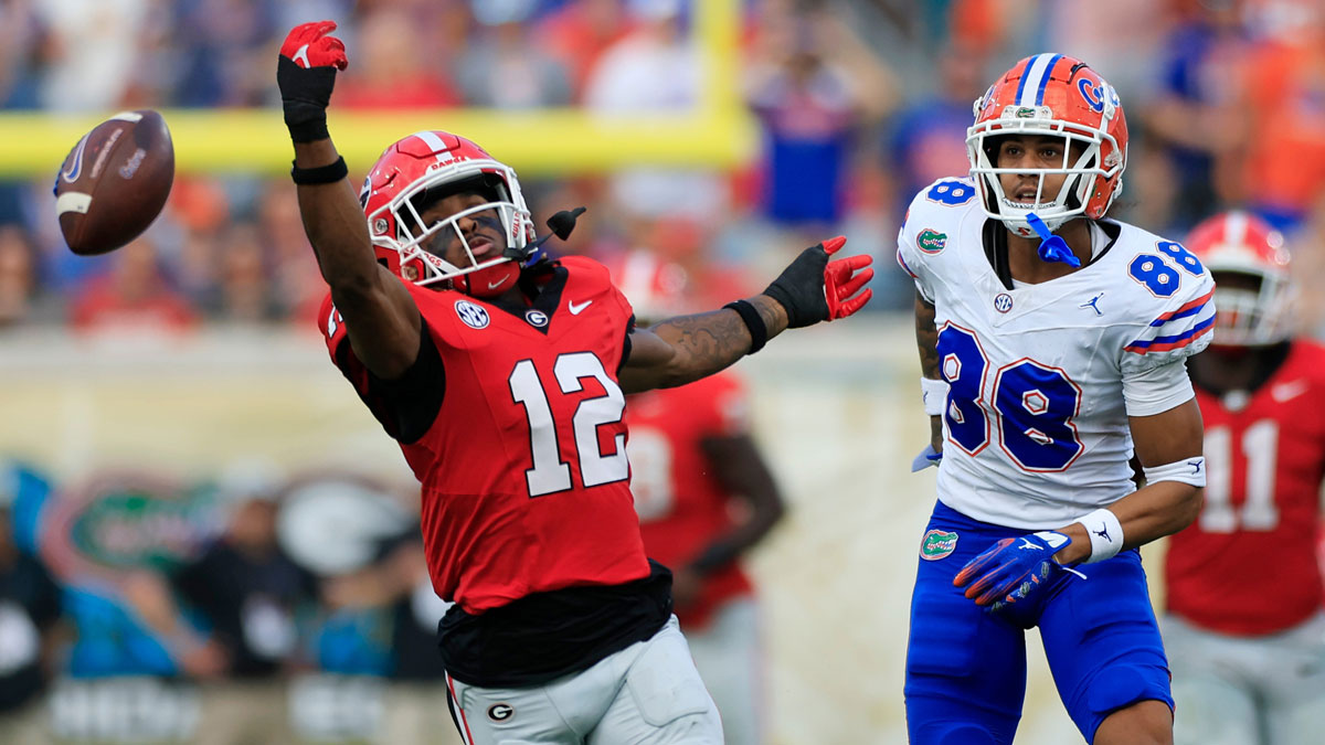 Georgia Bulldogs defensive back Julian Humphrey (12) can’t haul in an interception against Florida Gators wide receiver Marcus Burke (88) during the second quarter of an NCAA college football matchup Saturday, Nov. 2, 2024 at EverBank Stadium in Jacksonville, Fla. The Georgia Bulldogs defeated the Florida Gators 34-20.