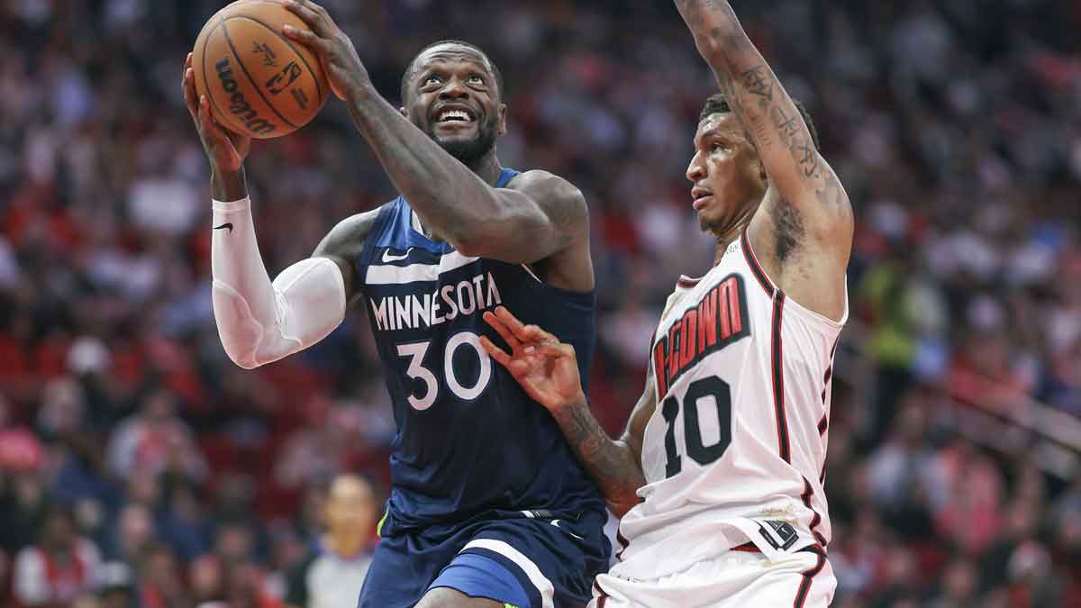 Julius Randle (30) attempts to score as Houston Rockets forward Jabari Smith Jr. (10) defends during the second quarter at Toyota Center.