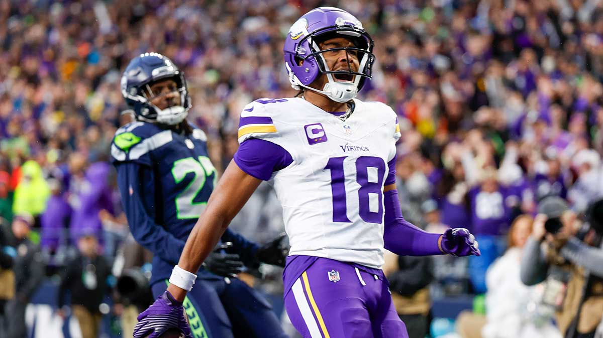 Minnesota Vikings wide receiver Justin Jefferson (18) celebrates after catching a touchdown pass against the Seattle Seahawks during the fourth quarter at Lumen Field.