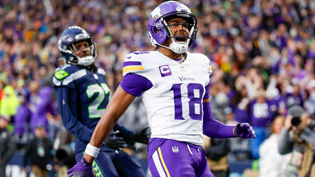 Minnesota Vikings wide receiver Justin Jefferson (18) celebrates after catching a touchdown pass against the Seattle Seahawks during the fourth quarter at Lumen Field.