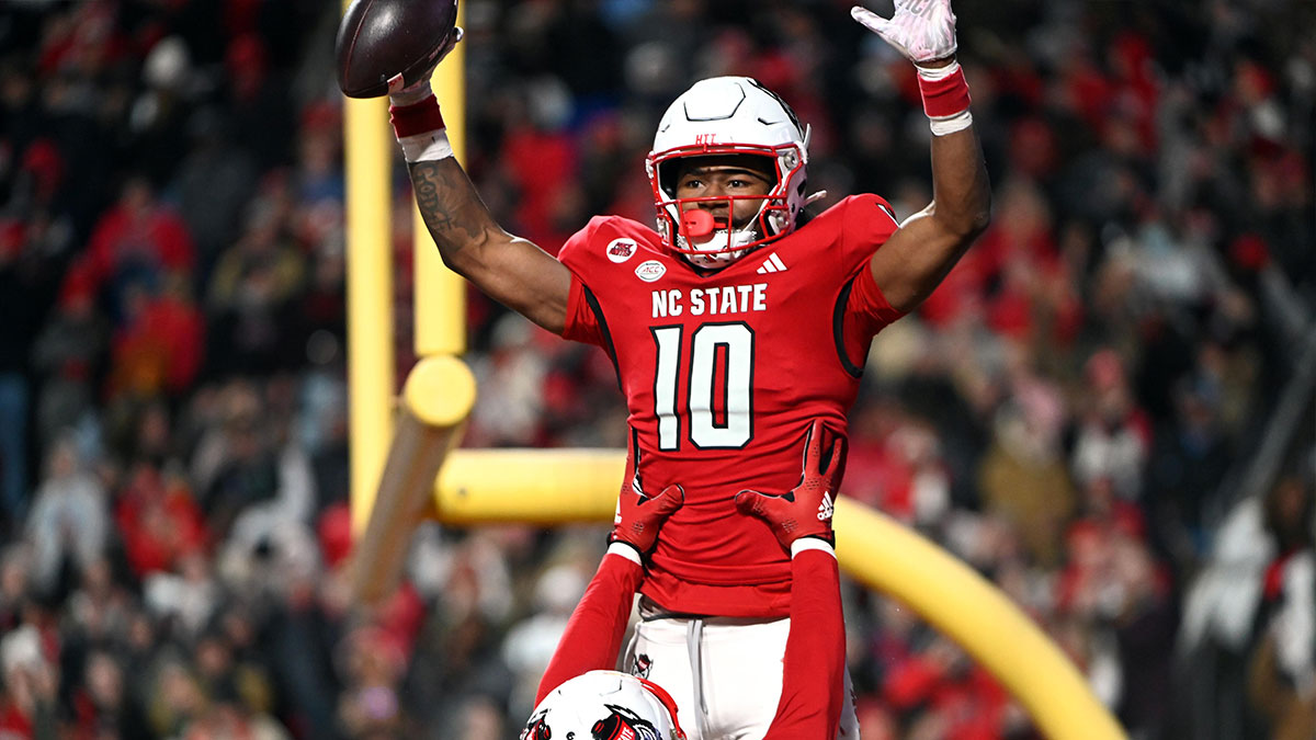 North Carolina State Wolfpack receiver KC Concepcion (10) celebrates after a touchdown against the North Carolina Tar Heels during the first half at Carter-Finley Stadium.