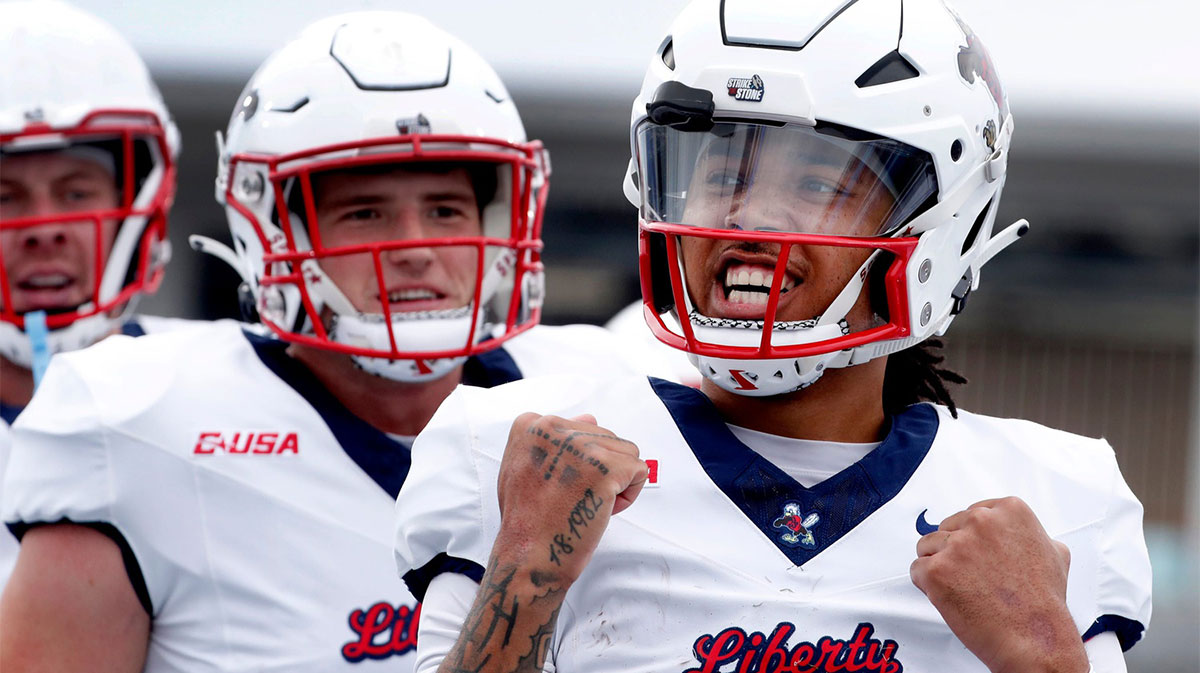 Liberty quarterback Kaidon Salter (7) celebrates his touchdown against Middle Tennessee during the Salute to Veterans & Armed Forces game at MTSU on Saturday, Nov. 9, 2024.