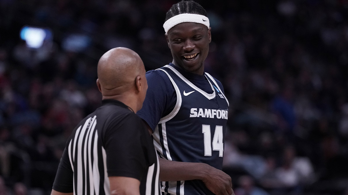 Samford Bulldogs forward Achor Achor (14) talks to an official during the second half in the first round of the 2024 NCAA Tournament against the Kansas Jayhawks at Vivint Smart Home Arena-Delta Center. 