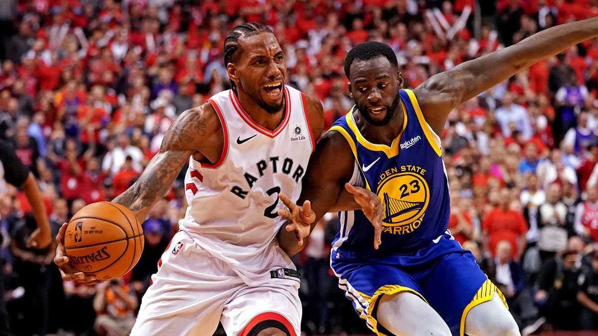 Toronto Raptors forward Kawhi Leonard (2) is fouled by Golden State Warriors forward Draymond Green (23) during the fourth quarter in game five of the 2019 NBA Finals at Scotiabank Arena.