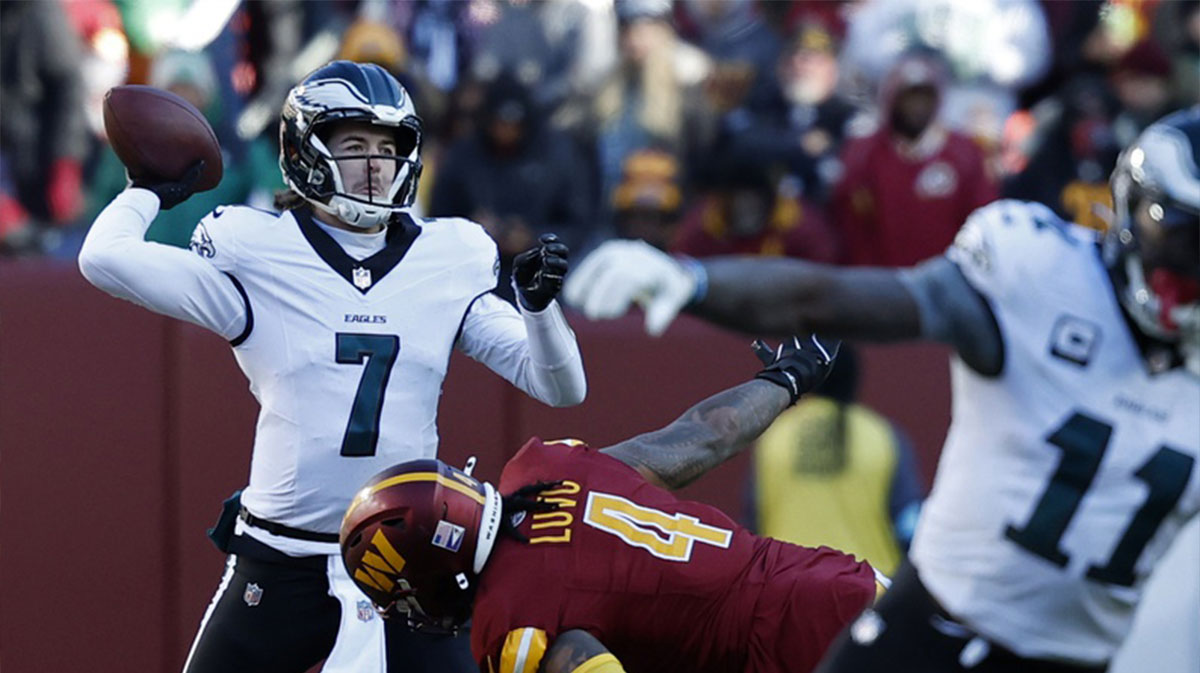 Philadelphia Eagles quarterback Kenny Pickett (7) passes the ball as Washington Commanders linebacker Frankie Luvu (4) defends during the second quarter at Northwest Stadium. 