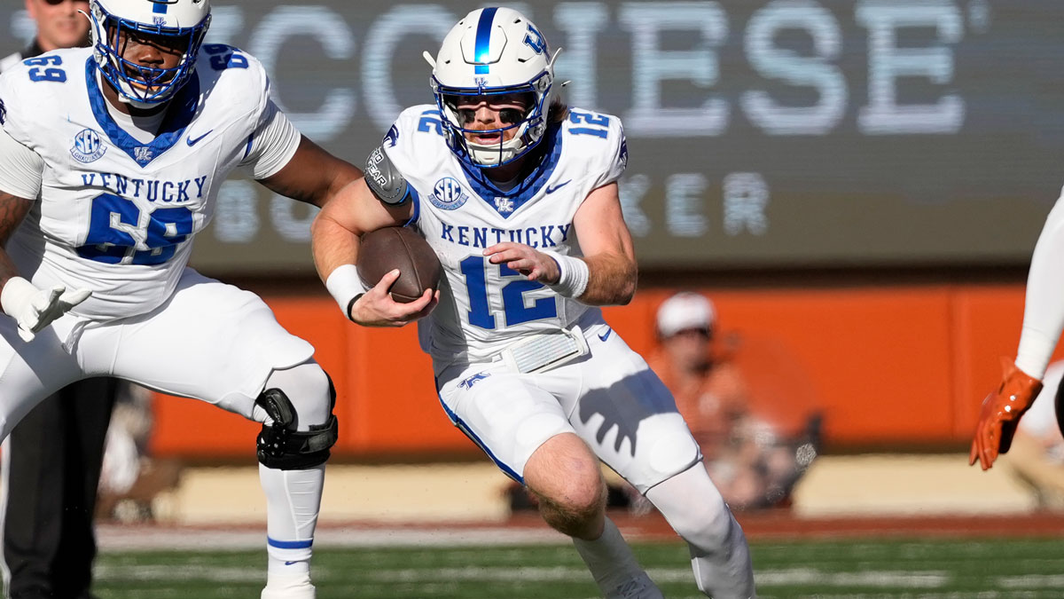 Kentucky Wildcats quarterback Brock Vandagriff (12) runs during the first half against the Texas Longhorns at Darrell K Royal-Texas Memorial Stadium.