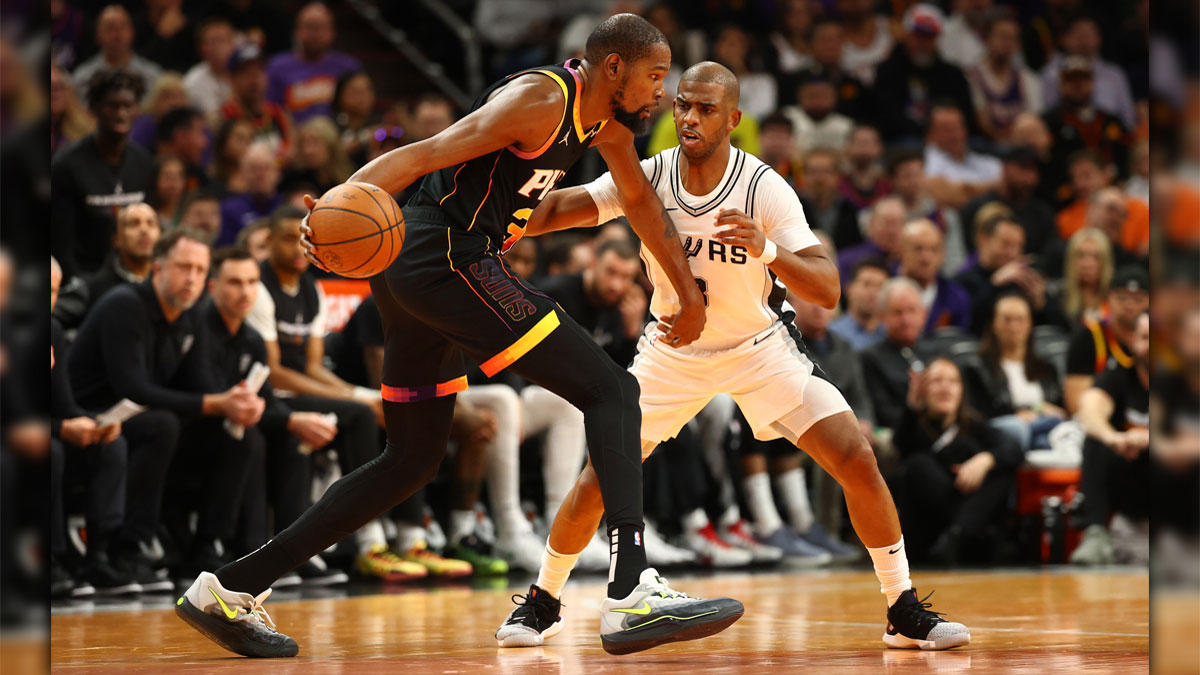 Phoenix Suns forward, Kevin Durant (35) against San Antonio Spurs Guard Chrisa Paul (3) in the first half of the NBA Cup game in the footprint center.