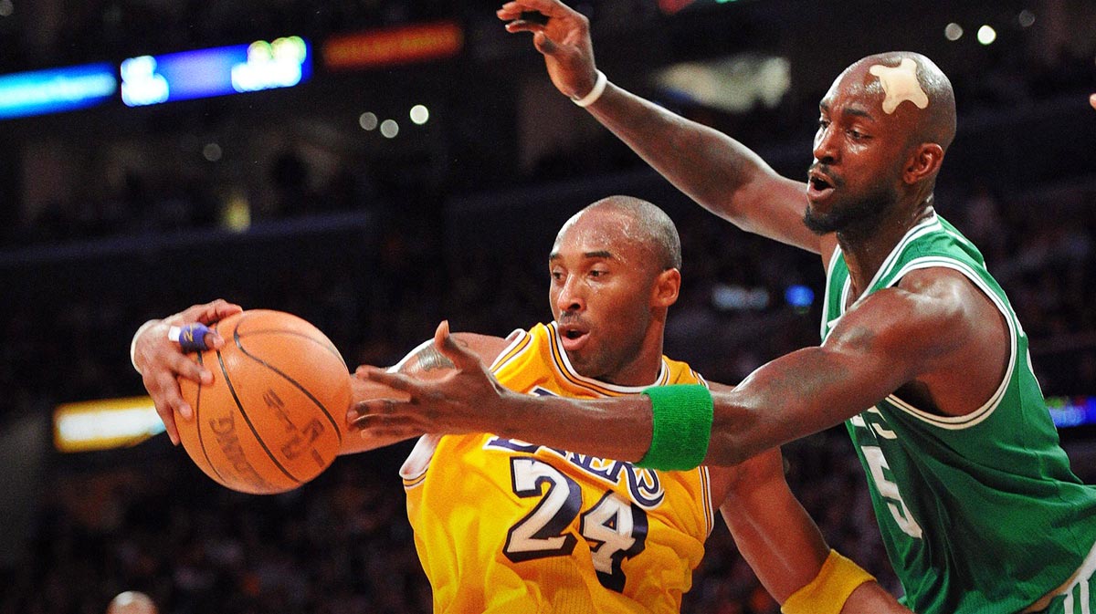 Boston Celtics forward Kevin Garnett (5) defends as Los Angeles Lakers guard Kobe Bryant (24) keeps control of the ball during the 4th quarter of the game at the Staples Center. The Celtics won 109-96.