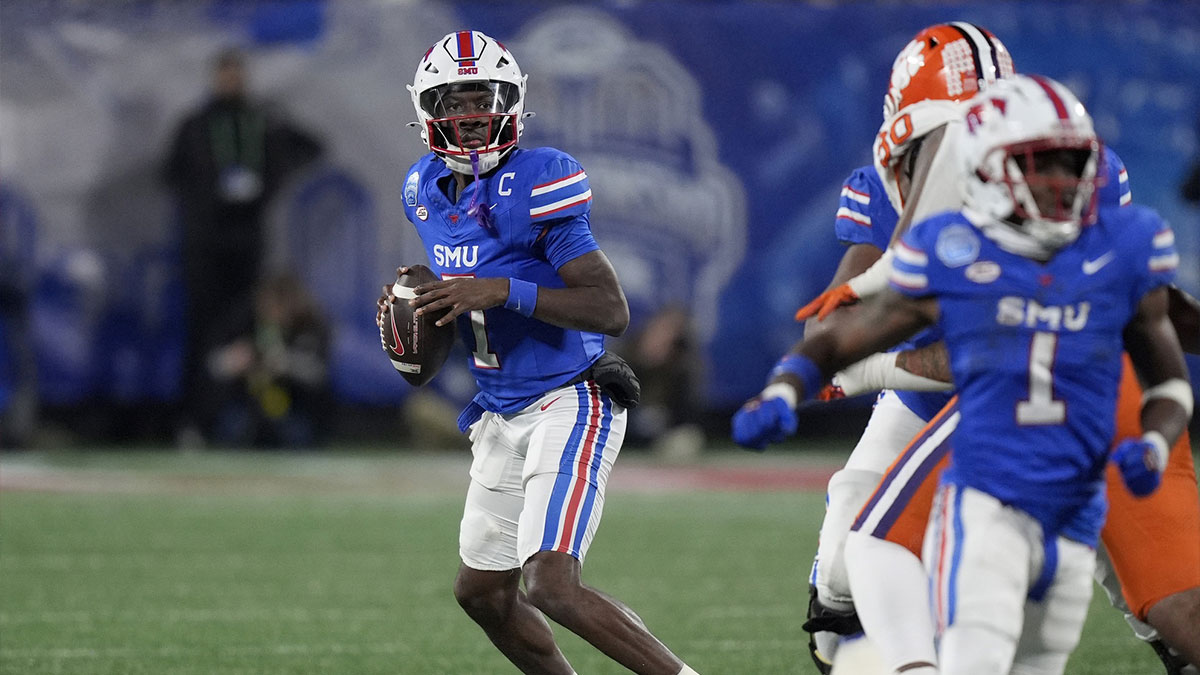 Southern Methodist Mustangs quarterback Kevin Jennings (7) drops to throw during the second quarter against the Clemson Tigers in the 2024 ACC Championship game at Bank of America Stadium.