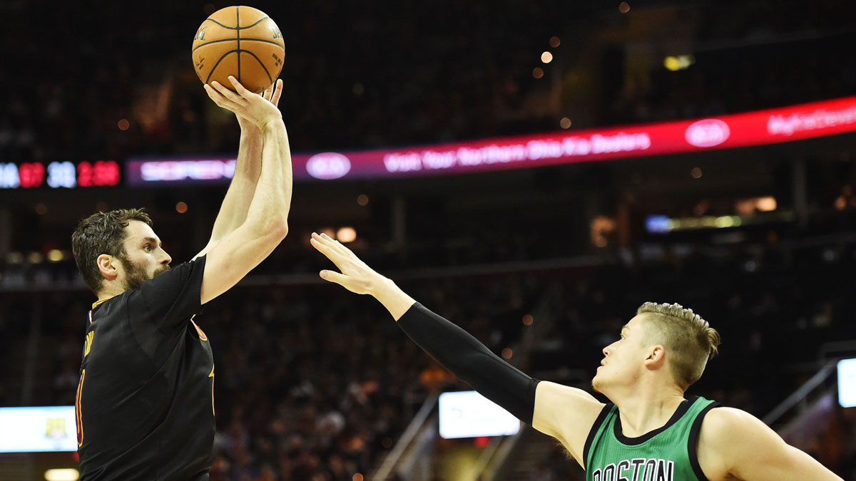 Cleveland Cavaliers forward Kevin Love (0) shoots over the defense of Boston Celtics forward Jonas Jerebko (8) during the first half at Quicken Loans Arena.