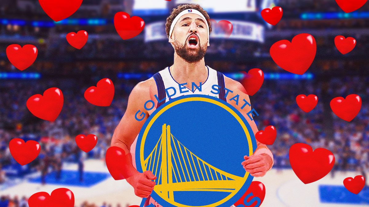Mavericks' Klay Thompson hugging the Golden State Warriors logo, hearts all over
