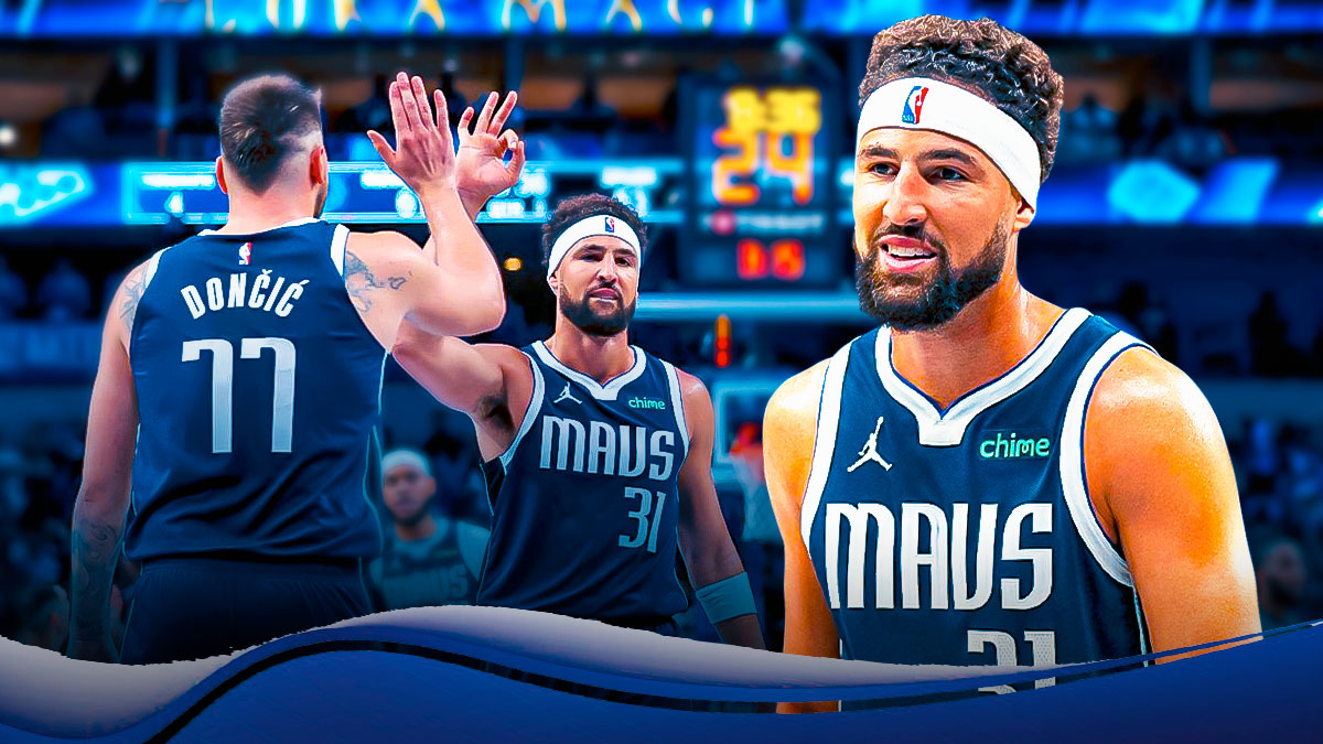 Mavericks Klay Thompson smiling in front. In background, find an image of Mavericks Klay Thompson and Mavericks Luka Doncic together.
