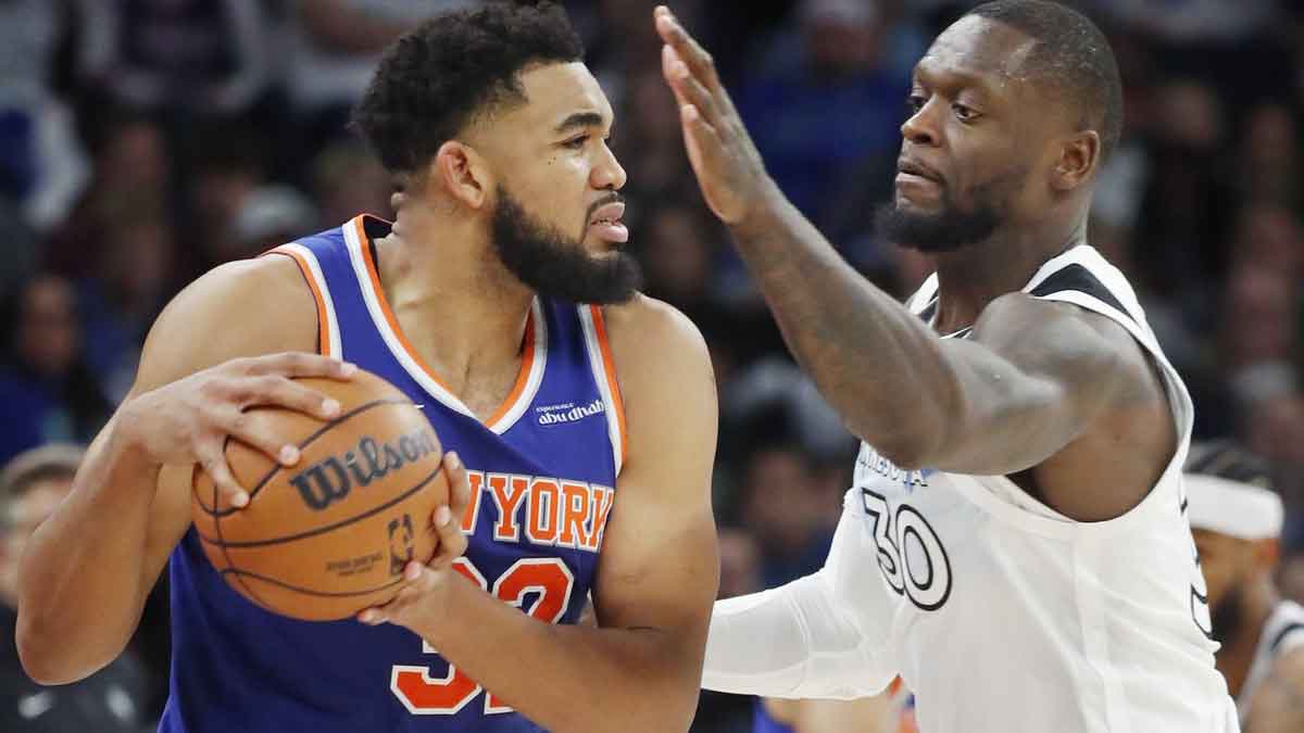 New York Knicks forward Karl-Anthony Towns (32) works around Minnesota Timberwolves forward Julius Randle (30) in the third quarter at Target Center.