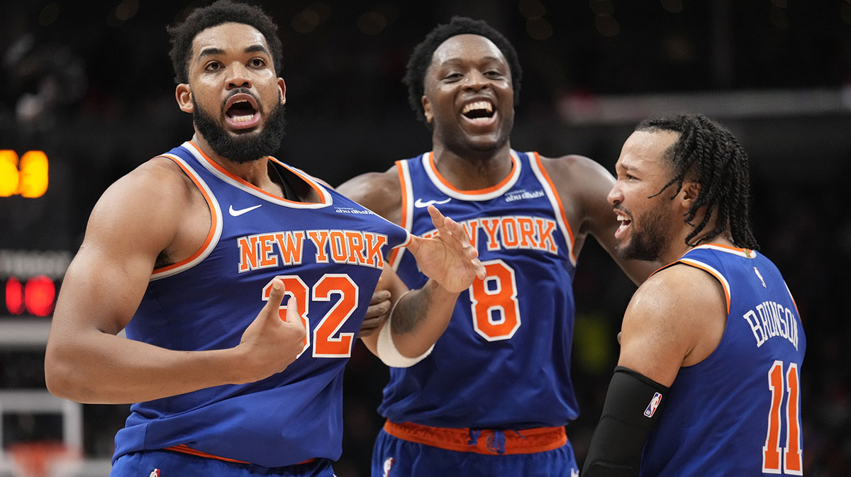 Knicks guard Jalen Brunson (11) and forward OG Anunoby (8) react after a three point basket by center Karl-Anthony Towns