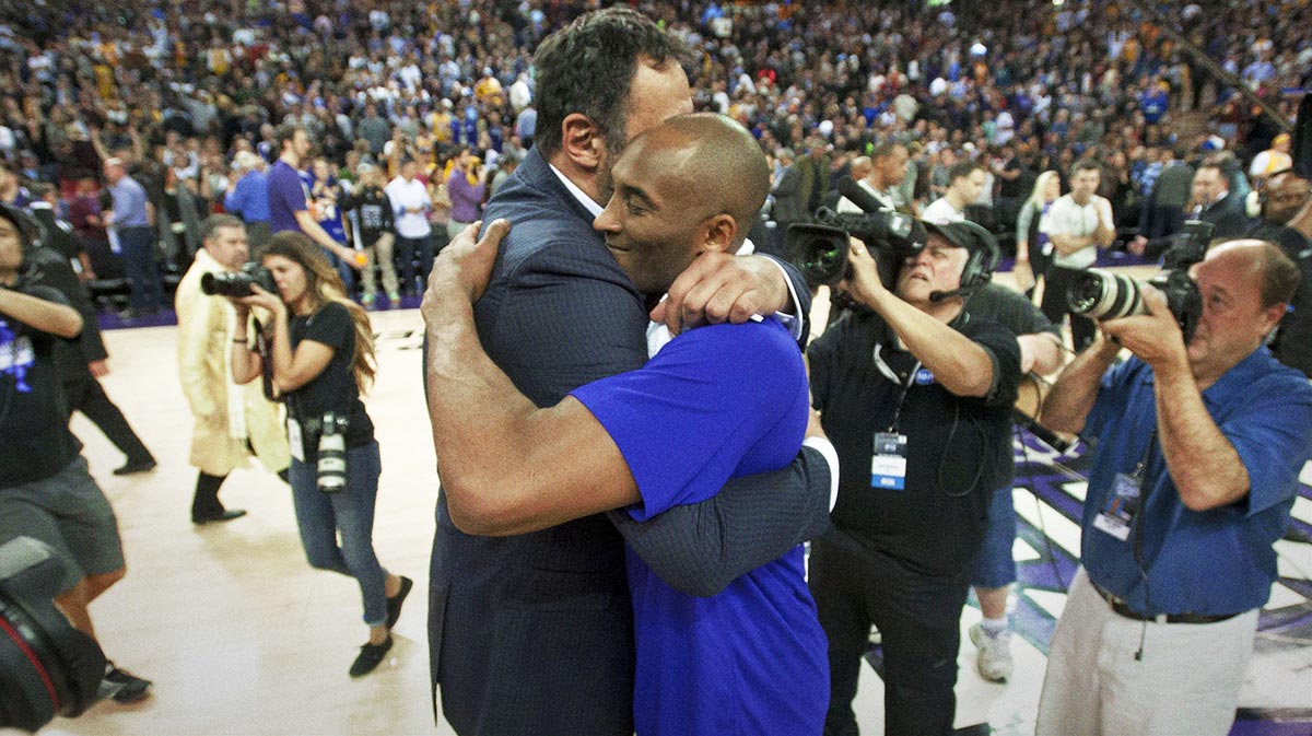 Los Angeles Lakers former center Vlade Divac hugs forward Kobe Bryant (24) after the game against the Sacramento Kings at Sleep Train Arena. The Sacramento Kings defeated the Los Angeles Lakers 118-115. 