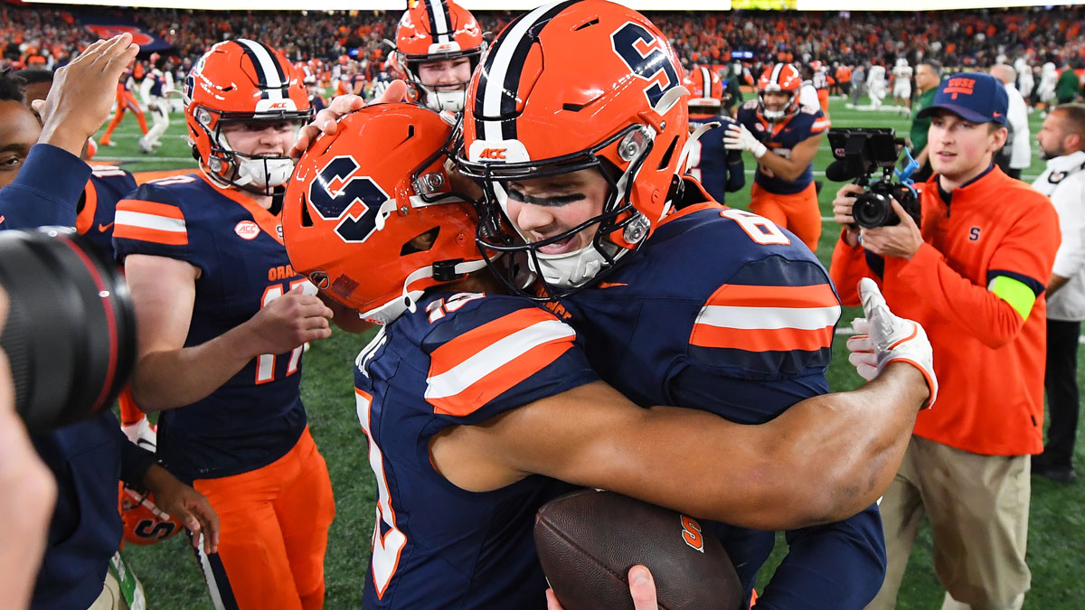 Syracuse Orange quarterback Kyle McCord (right) celebrates with tight end Jamie Tremble (left) following a game against the Miami Hurricanes at the JMA Wireless Dome.