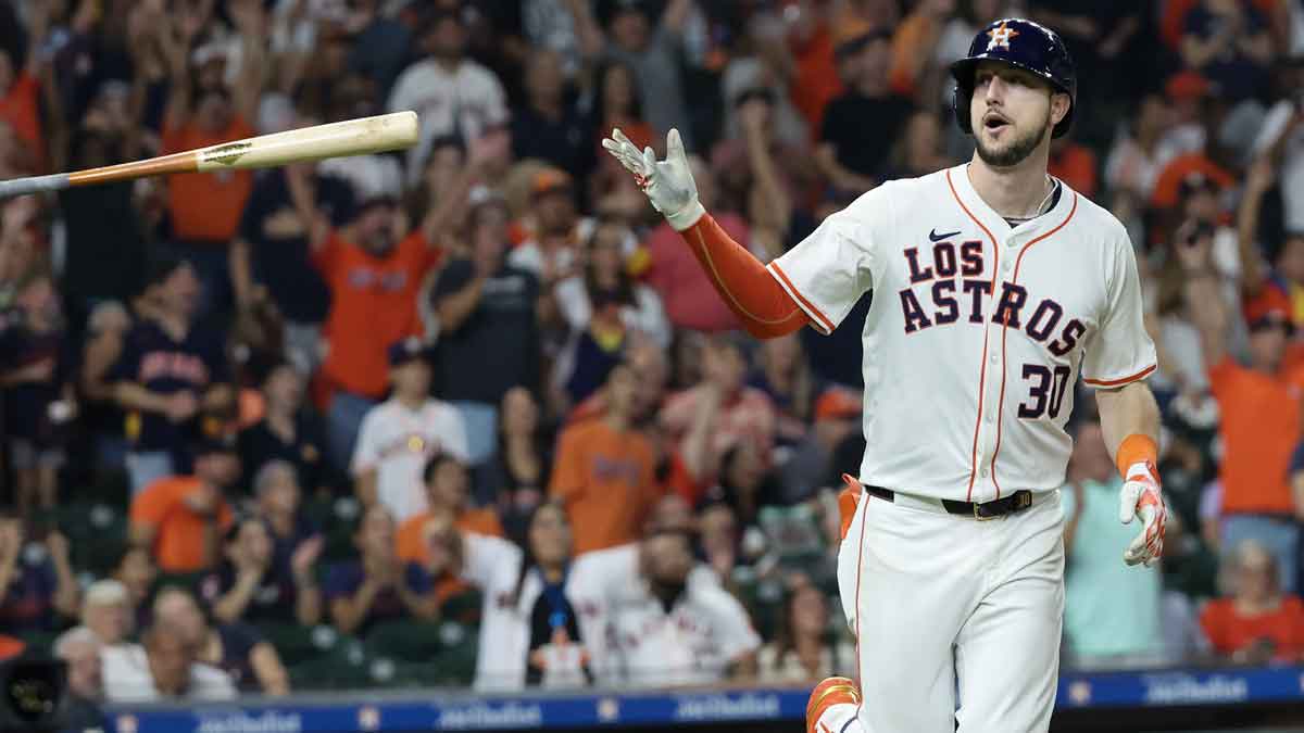 Houston Astros right fielder Kyle Tucker (30) flicks his bat after hitting a home run against the Los Angeles Angels in the seventh inning at Minute Maid Park.